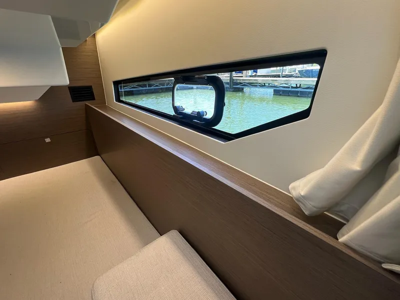 Slide: The Image of Interior view of 2025 Jeanneau NC 895 Sport S2, featuring a sleek window design. - 37