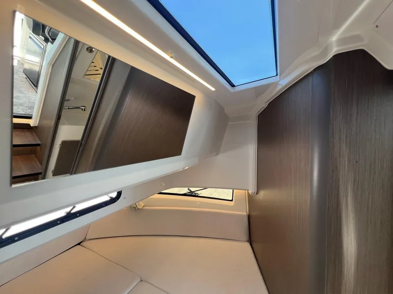 Slide: The Image of Interior cabin of 2025 Jeanneau NC 895 Sport S2 with modern design and skylight. - 45