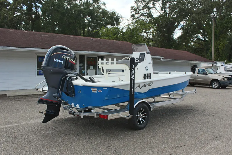 Slide: The Image of 2026 Avid 19 FSX boat with Yamaha engine on trailer, parked outdoors. - 33
