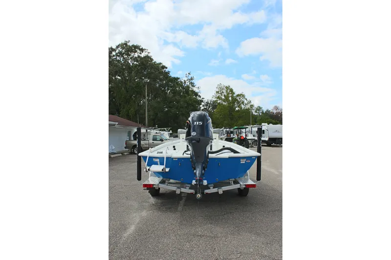 Slide: The Image of 2026 Avid 19 FSX boat on trailer, parked outdoors, rear view. - 34