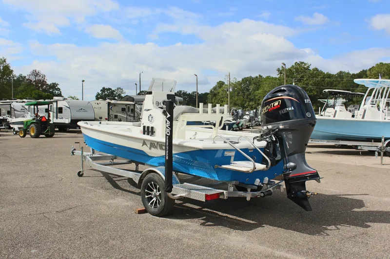 Slide: The Image of 2026 Avid 19 FSX boat with Yamaha motor on trailer in parking lot. - 35