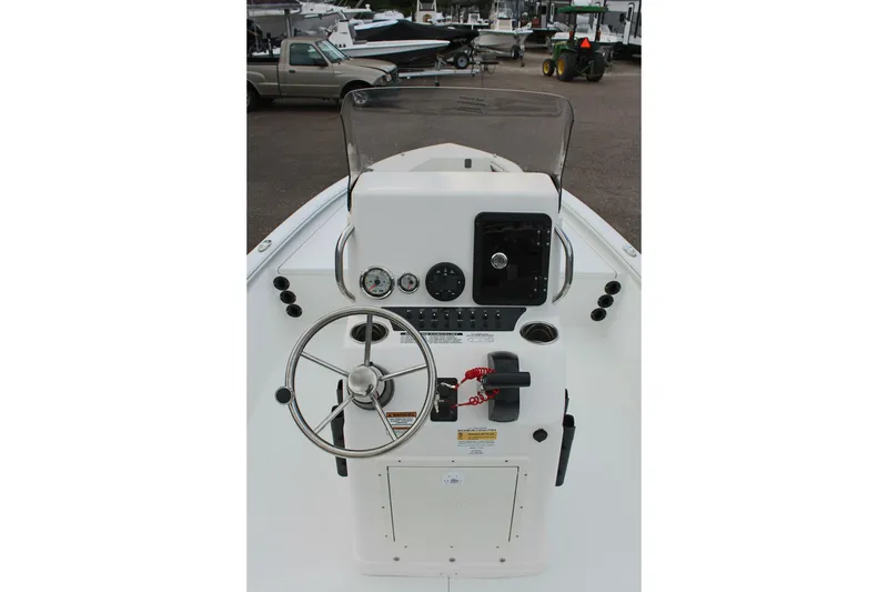 Slide: The Image of Center console of 2026 Avid 19 FSX boat with steering wheel and controls. - 42