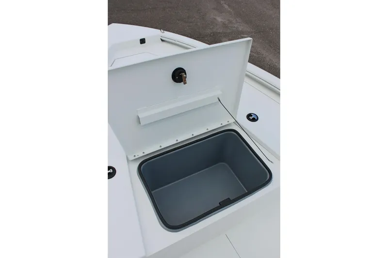 Slide: The Image of Open storage compartment on 2026 Avid 19 FSX boat, featuring a secure latch. - 48