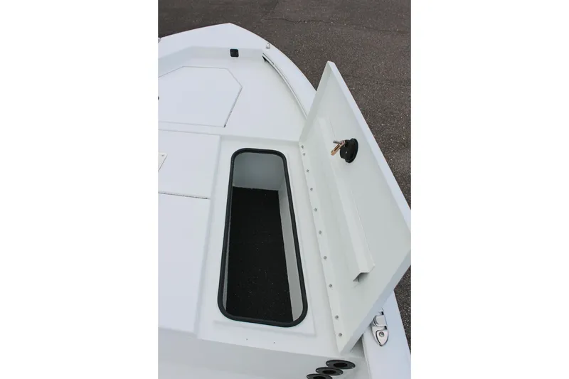 Slide: The Image of Open storage compartment on 2026 Avid 19 FSX boat deck. - 49