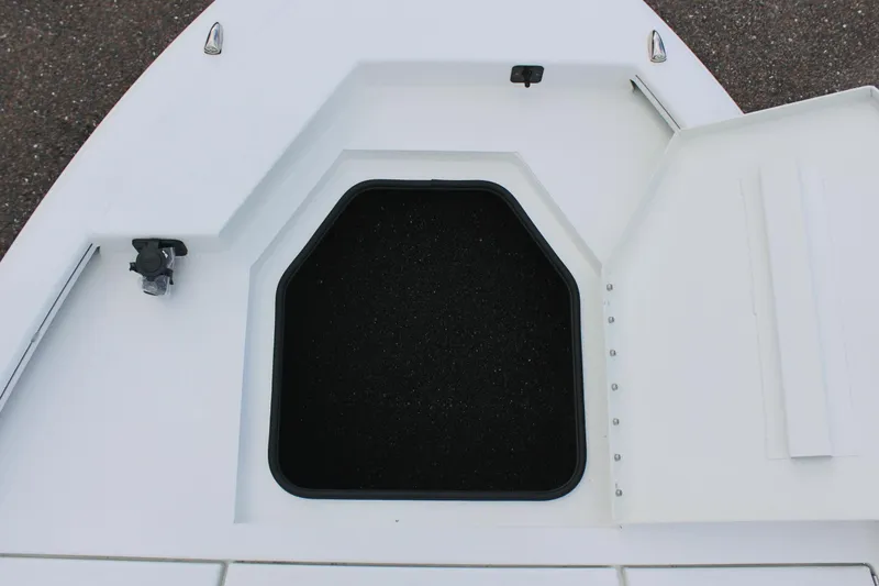 Slide: The Image of Open storage compartment on 2026 Avid 19 FSX boat deck. - 50