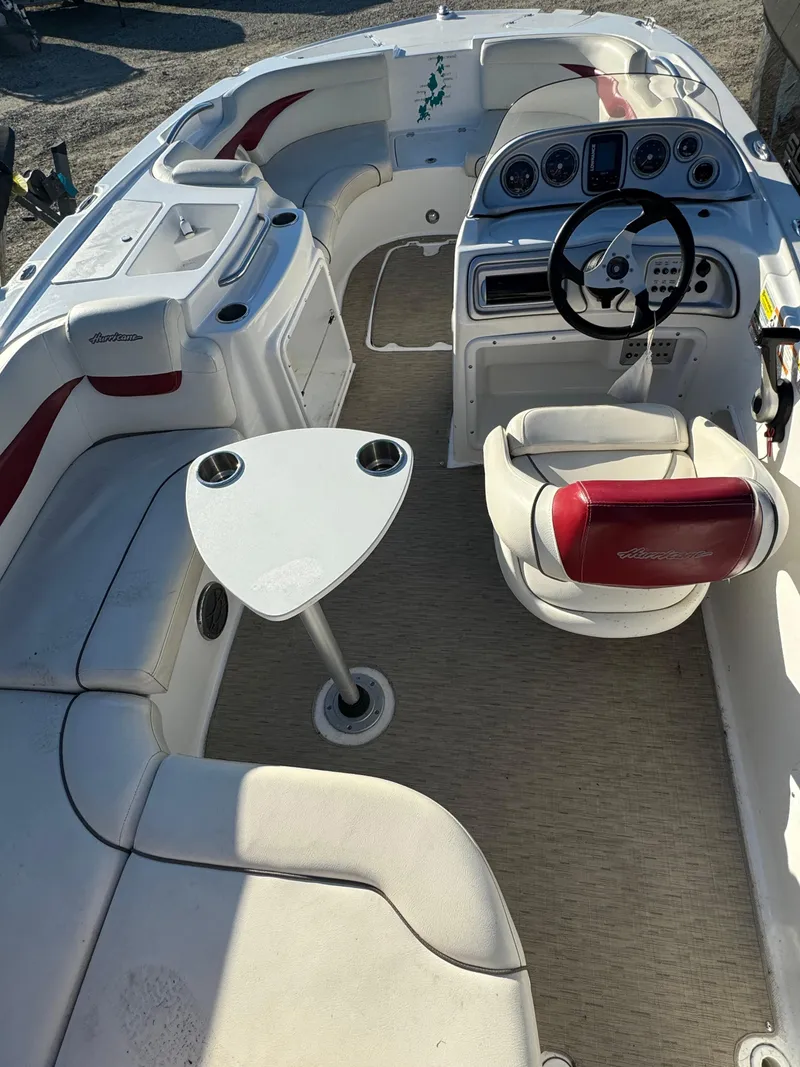 Slide: The Image of Interior of 2013 Hurricane SS 203 OB boat with seating and steering console. - 10