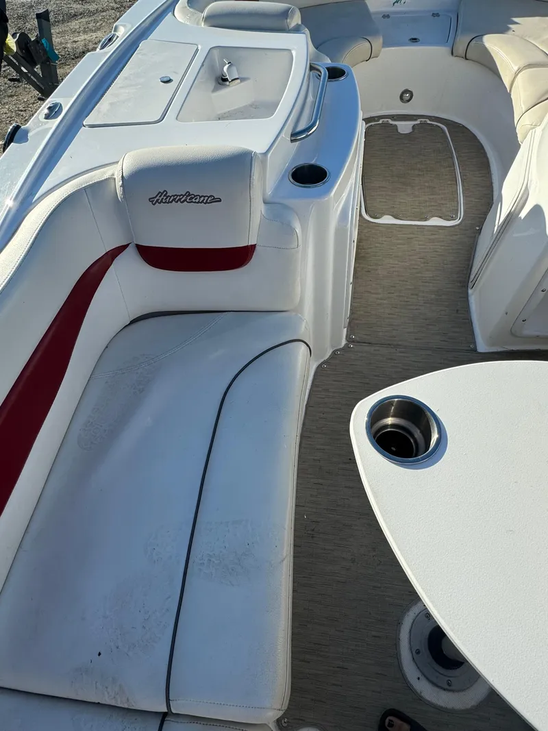 Slide: The Image of 2013 Hurricane SS 203 OB boat interior with white and red seating. - 11