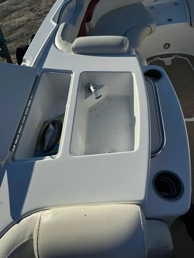 Slide: The Image of 2013 Hurricane SS 203 OB boat interior with storage compartment and seating. - 14
