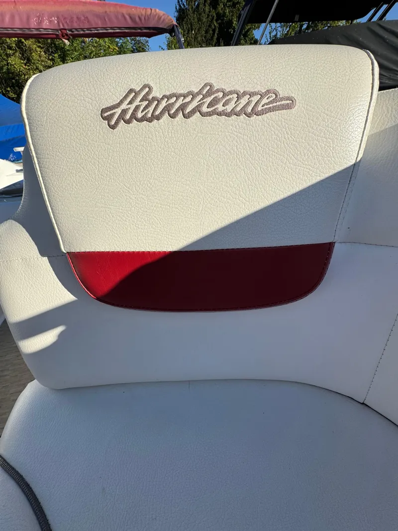 Slide: The Image of 2013 Hurricane SS 203 OB boat seat with logo, white and red upholstery. - 17