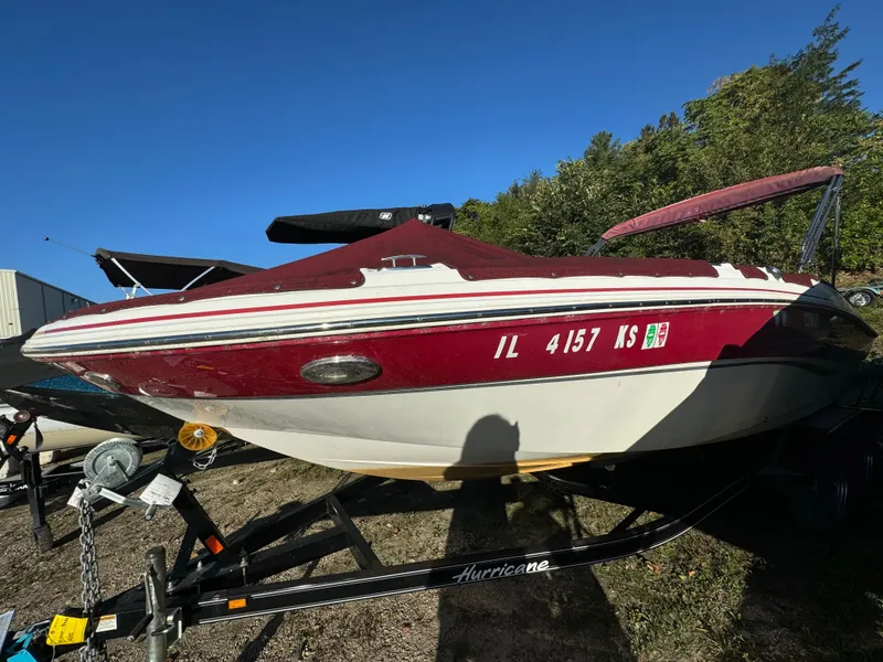 Slide: The Image of 2013 Hurricane SS 203 OB boat on trailer, red and white, parked outdoors. - 20