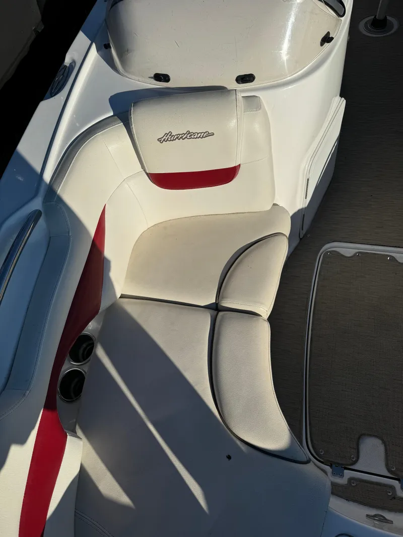 Slide: The Image of 2013 Hurricane SS 203 OB boat interior with white and red seating. - 4
