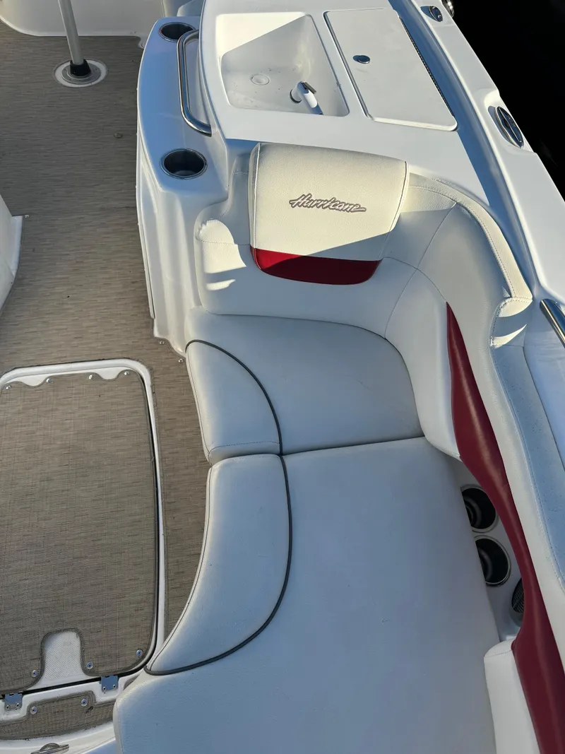 Slide: The Image of 2013 Hurricane SS 203 OB boat interior with white and red seating. - 5