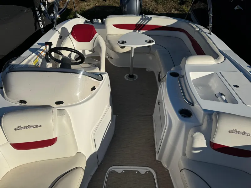 Slide: The Image of 2013 Hurricane SS 203 OB boat interior with seating and steering wheel. - 6