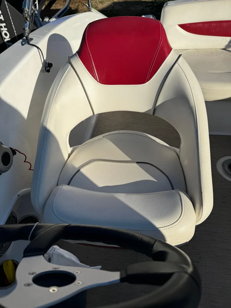 Slide: The Image of White and red boat seat in a 2013 Hurricane SS 203 OB. - 7