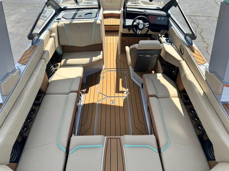 Slide: The Image of 2025 Nautique G23 boat interior with luxurious seating and modern design. - 14