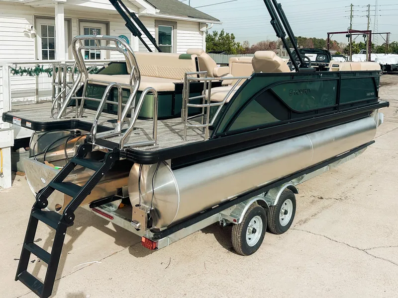 Slide: The Image of 2025 Godfrey SW 2286 SFL pontoon boat on trailer, featuring sleek design and comfortable seating. - 13