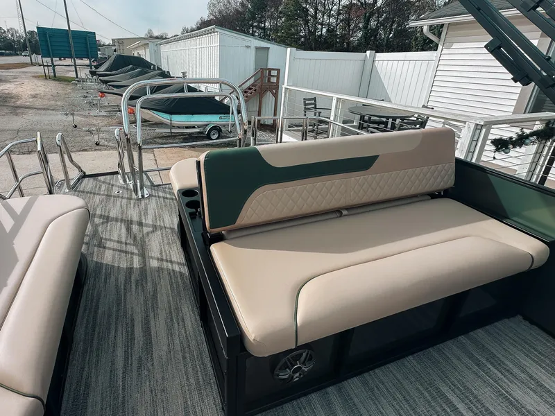 Slide: The Image of 2025 Godfrey SW 2286 SFL boat interior with beige seating and outdoor setting. - 4