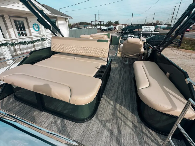 Slide: The Image of 2025 Godfrey SW 2286 SFL boat interior with beige seating and modern design. - 5