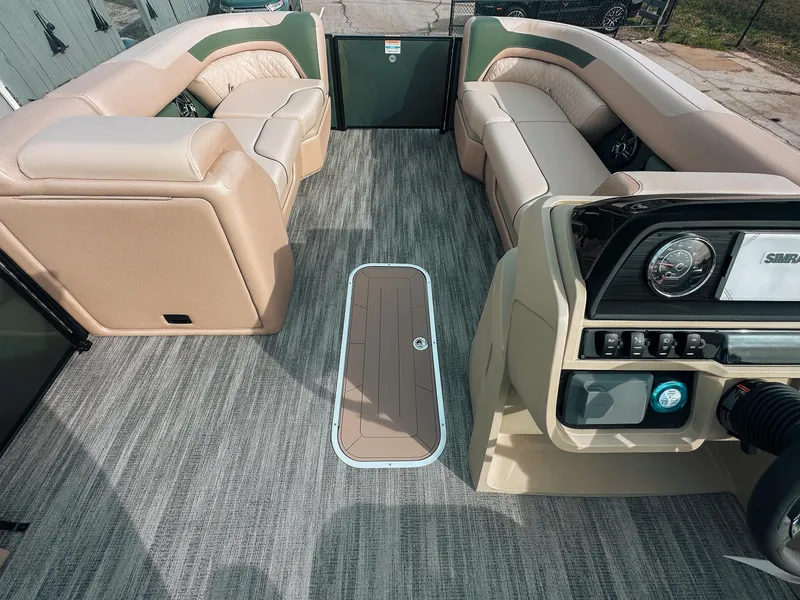 Slide: The Image of Interior of 2025 Godfrey SW 2286 SFL boat with plush seating and modern dashboard. - 7
