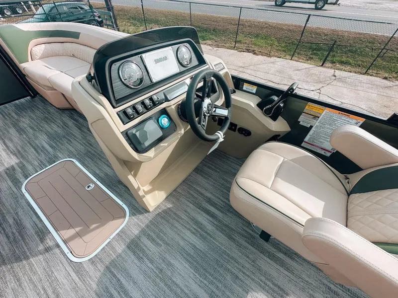 Slide: The Image of Interior of 2025 Godfrey SW 2286 SFL boat with modern steering console and seating. - 8