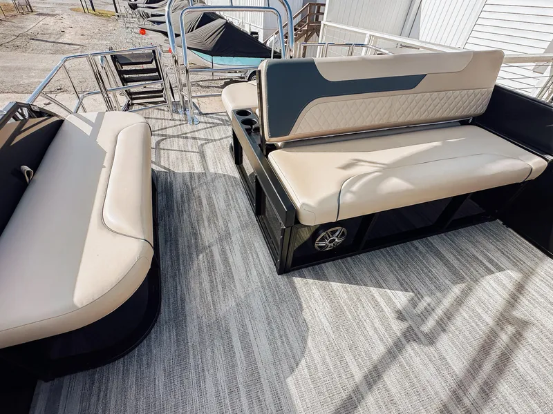 Slide: The Image of 2025 Godfrey Sweetwater 22' Flip Lounge Tritoon with beige seating and spacious deck. - 18