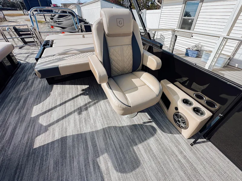 Slide: The Image of 2025 Godfrey Sweetwater 22' Flip Lounge Tritoon interior with luxury seating and cup holders. - 23