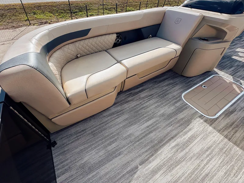 Slide: The Image of 2025 Godfrey Sweetwater 22' Flip Lounge Tritoon interior with beige seating and modern design. - 24