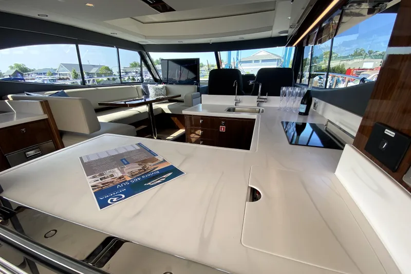 Slide: The Image of Luxurious interior of 2025 Riviera 465 SUV yacht with modern seating and sleek design. - 18