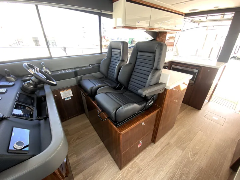 Slide: The Image of Interior of 2025 Riviera 465 SUV yacht with luxurious seating and modern design. - 25