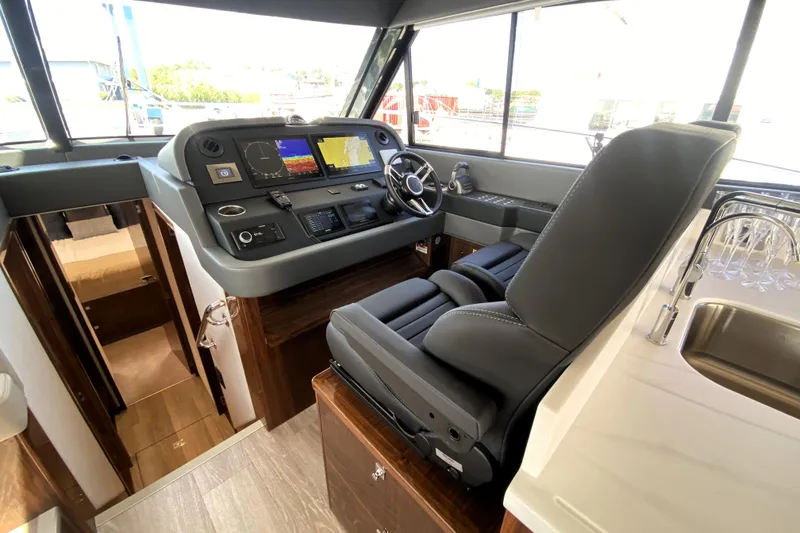 Slide: The Image of 2025 Riviera 465 SUV helm with modern controls and luxurious seating. - 26