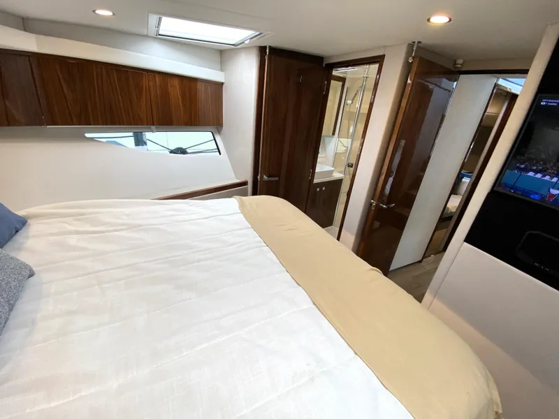 Slide: The Image of Luxurious interior of 2025 Riviera 465 SUV yacht with modern bedroom and sleek design. - 29