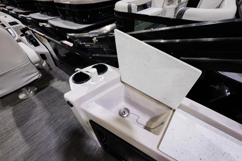 Slide: The Image of 2025 Godfrey Sweetwater 24' Tritoon with drop table lounge and integrated sink. - 19