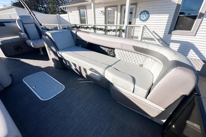 Slide: The Image of 2025 Godfrey Sweetwater 24' Tritoon with luxurious drop table lounge seating. - 30