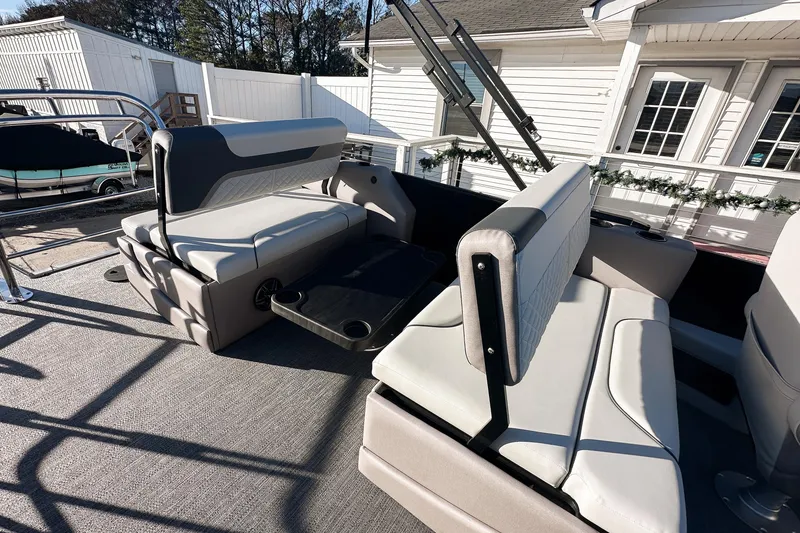 Slide: The Image of 2025 Godfrey Sweetwater 24' Tritoon with drop table lounge seating. - 36