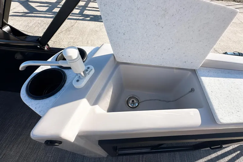 Slide: The Image of 2025 Godfrey Sweetwater 24' Tritoon sink and cup holders on deck. - 38