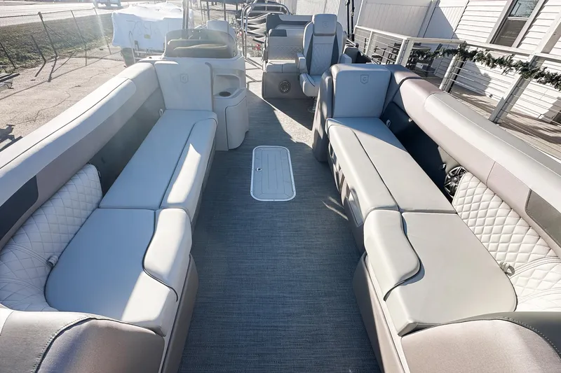 Slide: The Image of Luxurious interior of 2025 Godfrey Sweetwater 24' Drop Table Lounge Tritoon, featuring plush seating. - 5