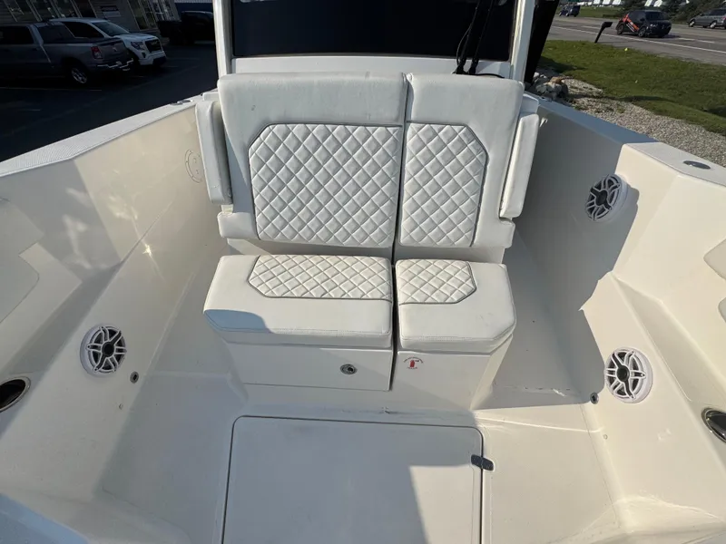 Slide: The Image of 2025 Pursuit S 288 Sport boat seating with quilted white upholstery. - 10