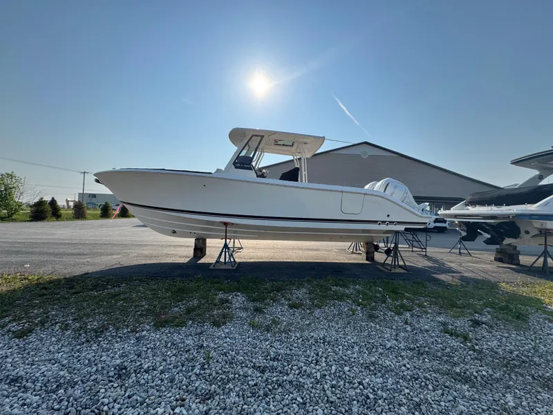 Slide: The Image of 2025 Pursuit S 288 Sport boat on display under clear sky. - 4
