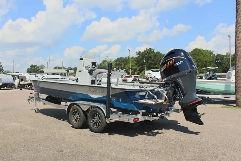 Slide: The Image of 2025 Avid 23 FSX boat with Yamaha outboard motor on trailer. - 10