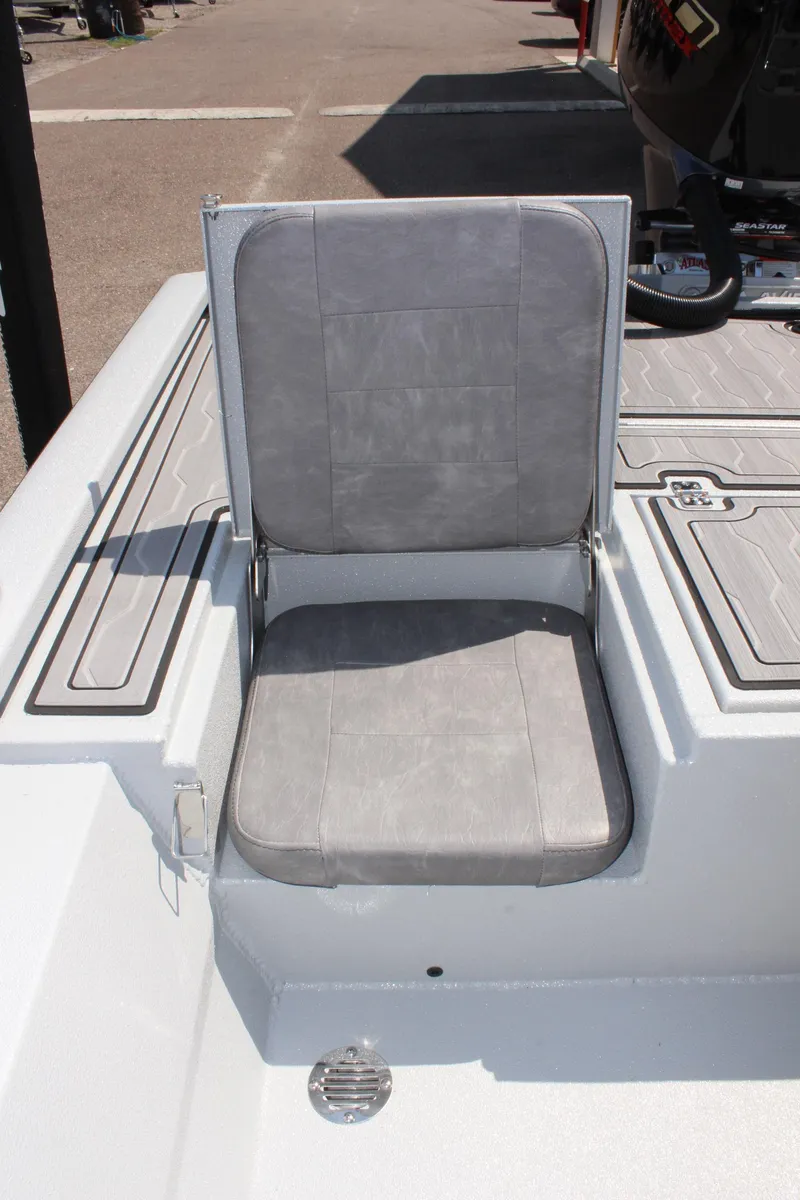 Slide: The Image of 2025 Avid 23 FSX boat seat with gray upholstery and sleek design. - 17