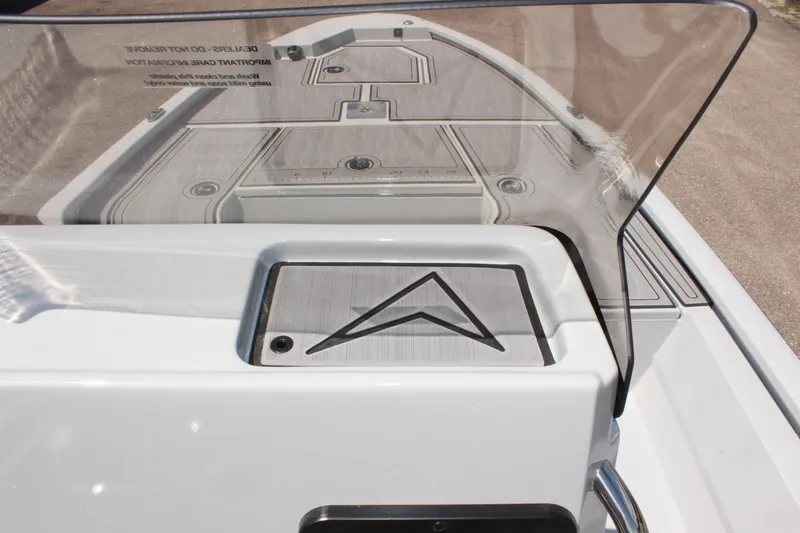 Slide: The Image of Avid 23 FSX 2025 boat deck with sleek design and windshield. - 24
