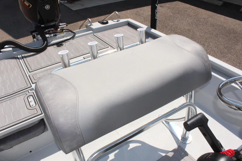 Slide: The Image of 2025 Avid 23 FSX boat interior with cushioned seating and rod holders. - 25