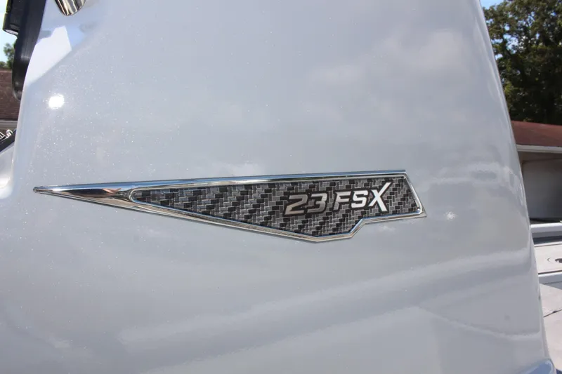 Slide: The Image of Avid 23 FSX 2025 model badge on sleek white surface. - 27