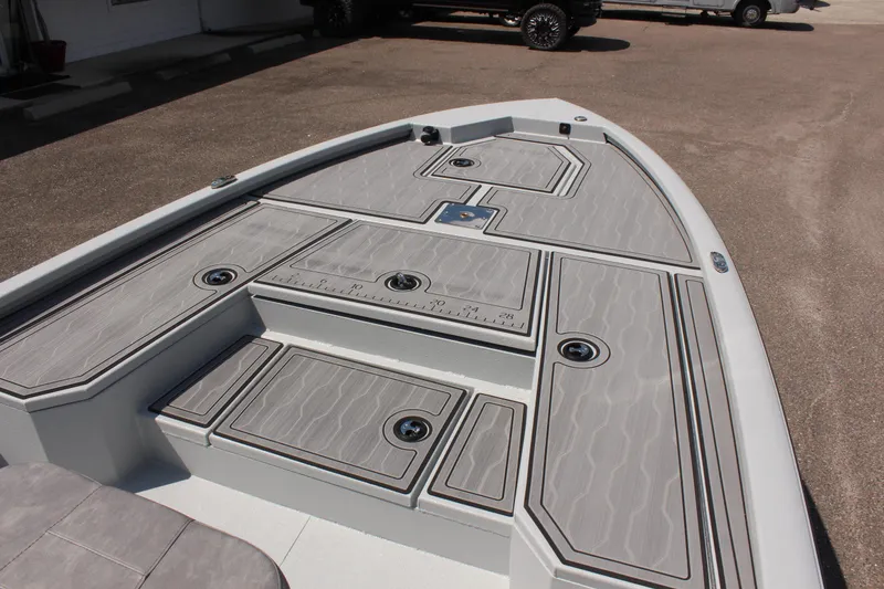 Slide: The Image of 2025 Avid 23 FSX boat deck with storage compartments and sleek design. - 28