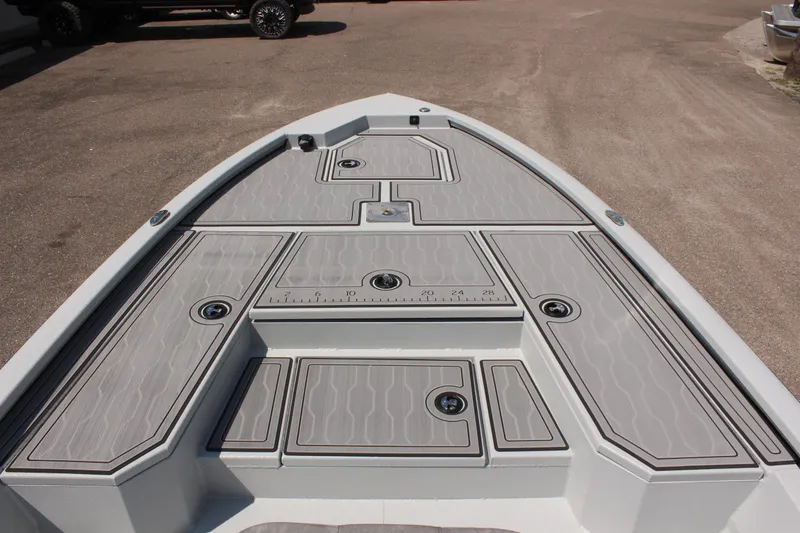 Slide: The Image of 2025 Avid 23 FSX boat deck with storage compartments and non-slip surface. - 29