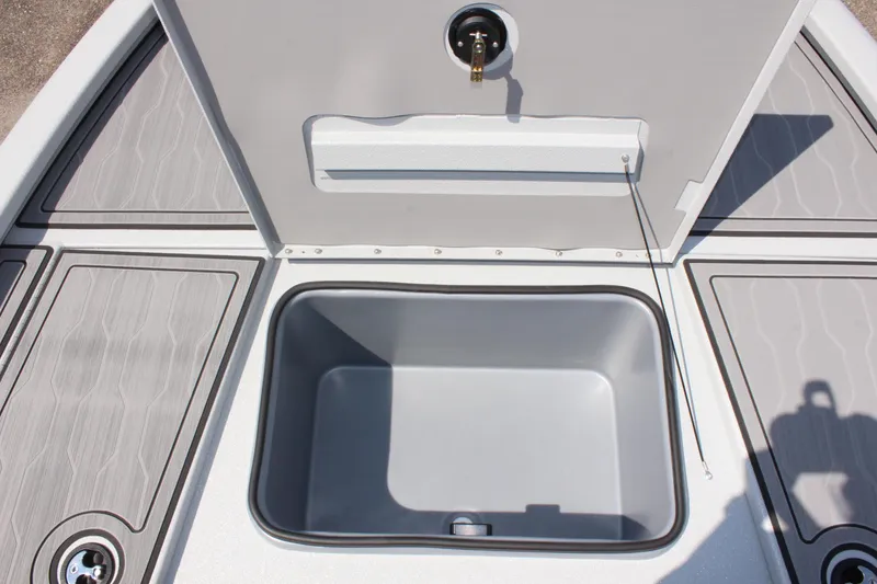 Slide: The Image of 2025 Avid 23 FSX boat storage compartment with open lid. - 34