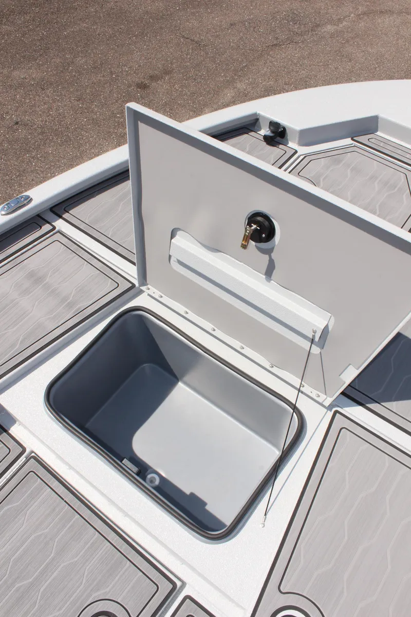 Slide: The Image of Avid 23 FSX 2025 boat storage compartment with open hatch. - 35