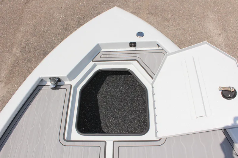 Slide: The Image of 2025 Avid 23 FSX boat deck with open storage compartment. - 36
