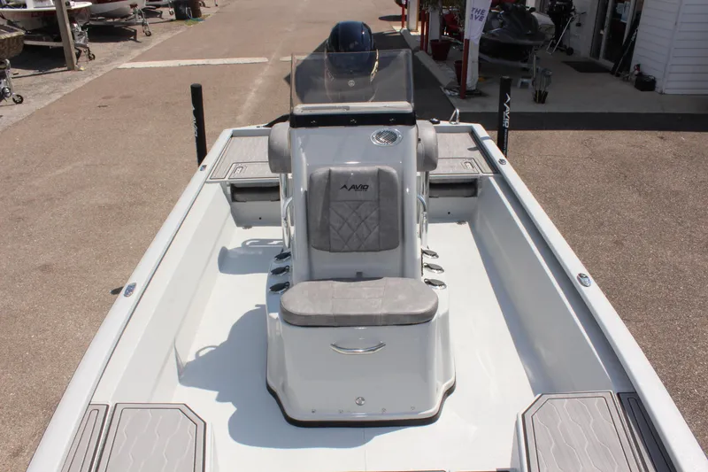 Slide: The Image of 2025 Avid 23 FSX boat interior with center console and seating. - 37