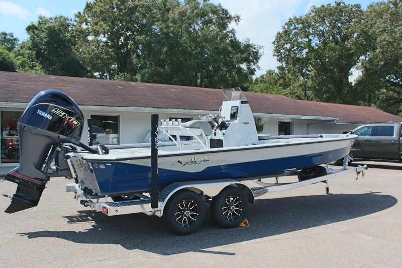 Slide: The Image of 2025 Avid 23 FSX boat with Yamaha engine on trailer, parked outdoors. - 8